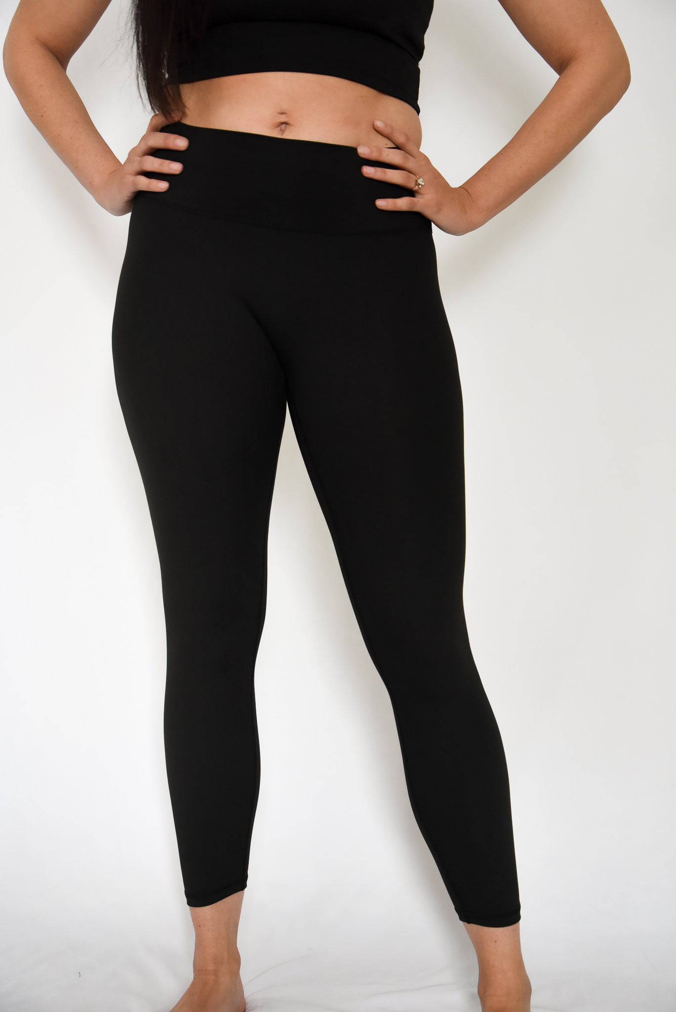 Anthem Leggings Black Front with Hands on Hips in Comfortable Stance