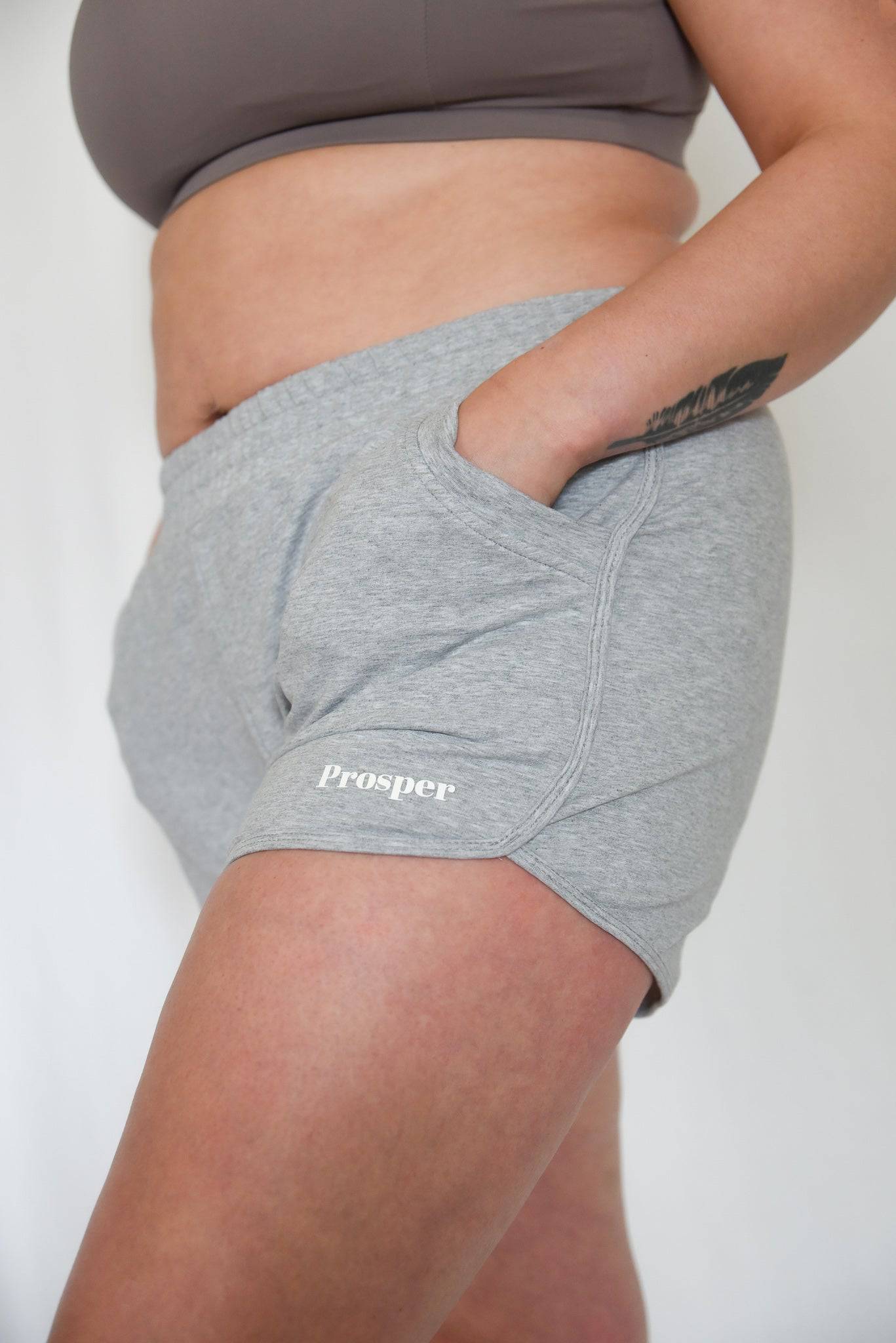 Cotton Dream Shorts in grey from left side with "Prosper" on front left leg